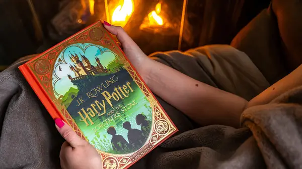 Hands holding a copy of 