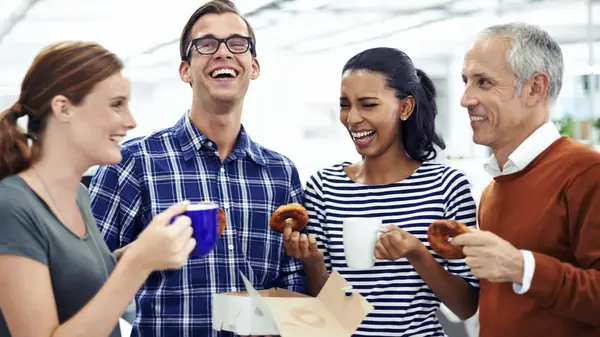 A group of people interact over coffee