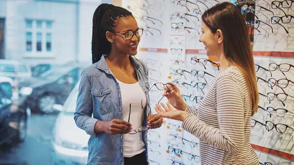 woman buying glasses