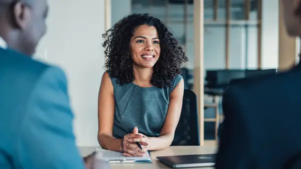 Woman talking with colleagues