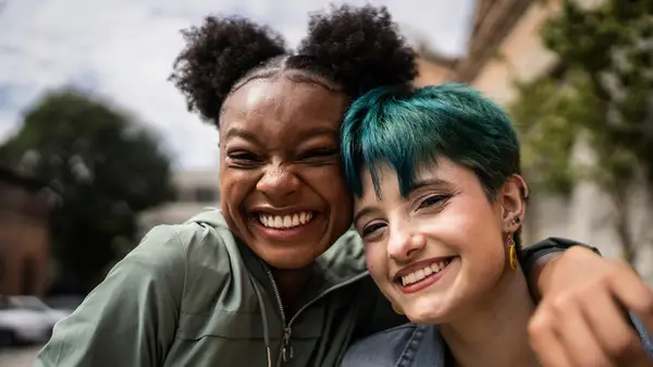 friends embrace outside