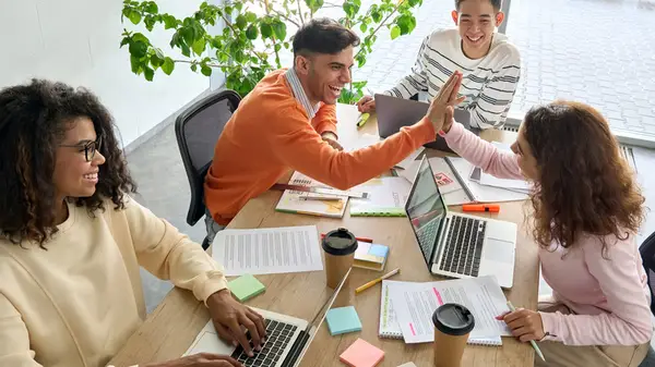 Coworkers highfiving