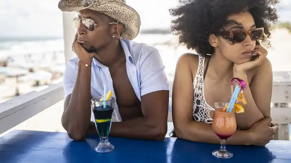 unhappy couple on vacation