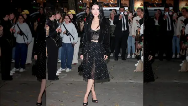 Woman wearing black polka dot skirt