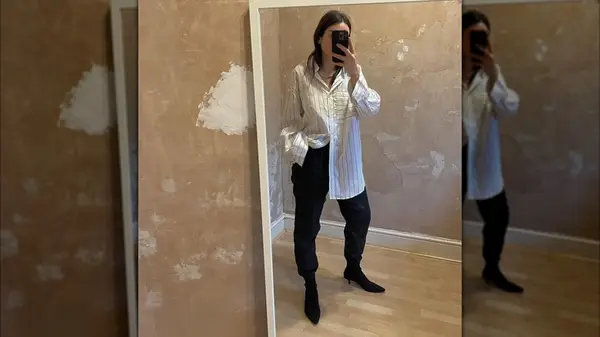 A woman on Instagram taking a selfie wearing sock boots