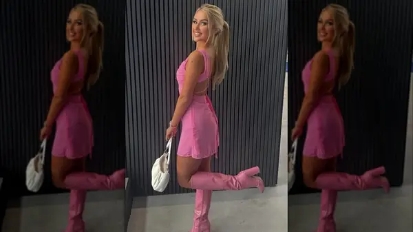 A woman on Instagram wearing Barbie pink boots and a dress