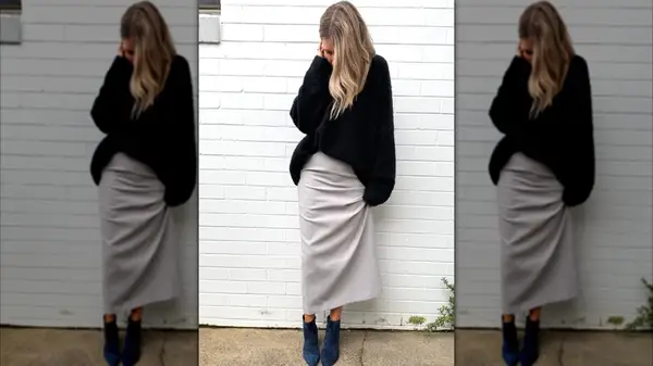 A woman on Instagram wearing a skirt and ankle boots