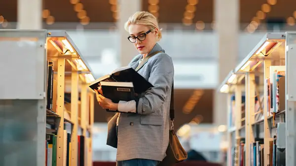 Woman looking at books