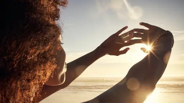 Woman looking at the sun
