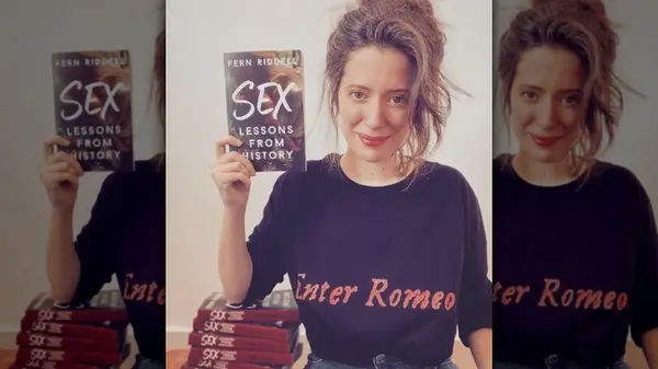 Fern Riddell holding her book