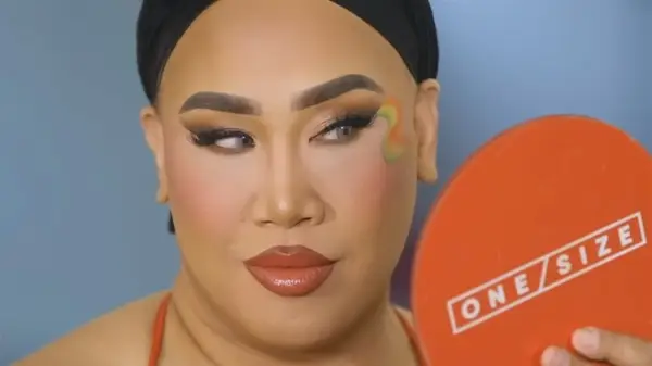 Patrick Starrr looking in a mirror