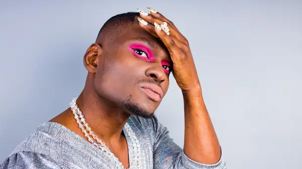 Gender fluid person with bright eyeshadow