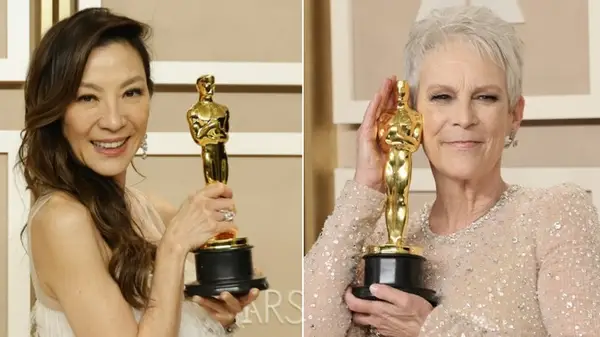 Michelle Yeoh and Jamie Lee Curtis with their Oscar statues