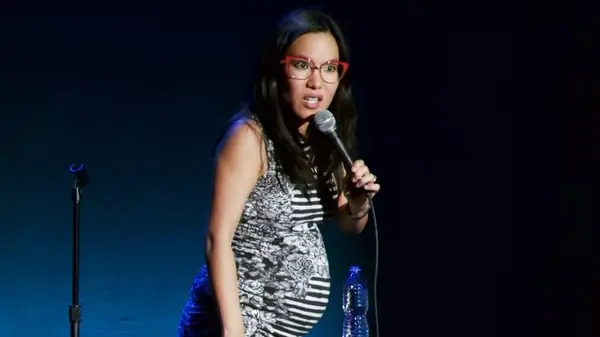 A pregnant Ali Wong doing stand-up comedy