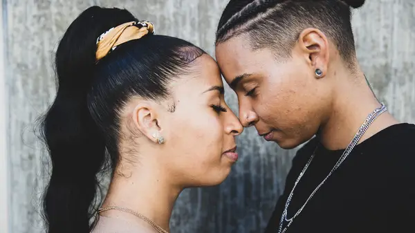 Queer couple face to face