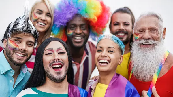 An LGBTQ+ group, all smiling