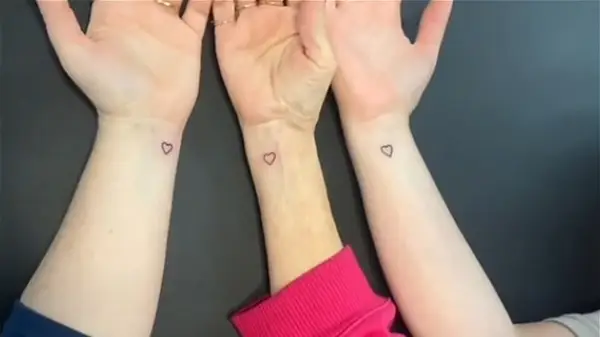 Three matching heart tattoos