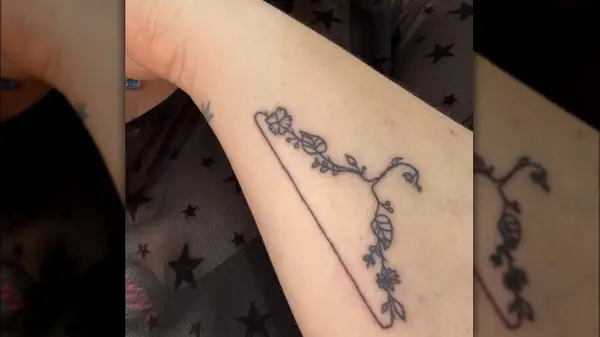 A floral coat hanger tattoo