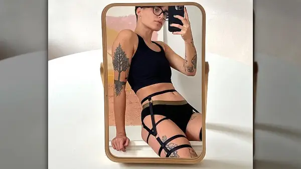 Person in Origami Customs lingerie