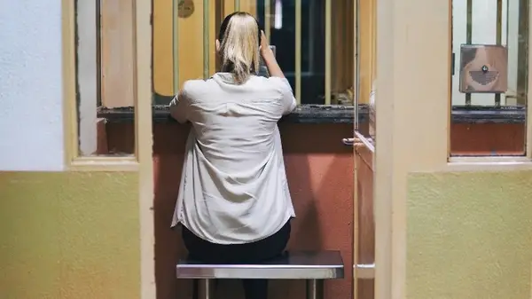 Woman waiting for a visit in prison