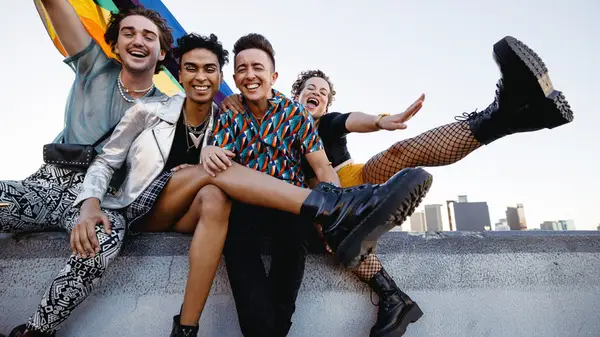 four friends celebrate pride