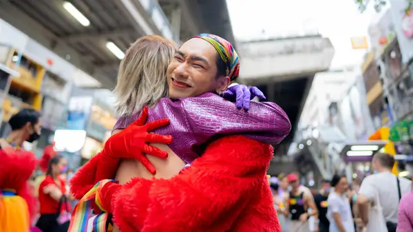 pride march hugging people