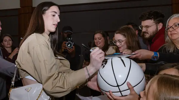 Caitlin Clark signing autographs