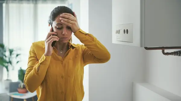 Woman appears frustrated and sad while on her cell phone