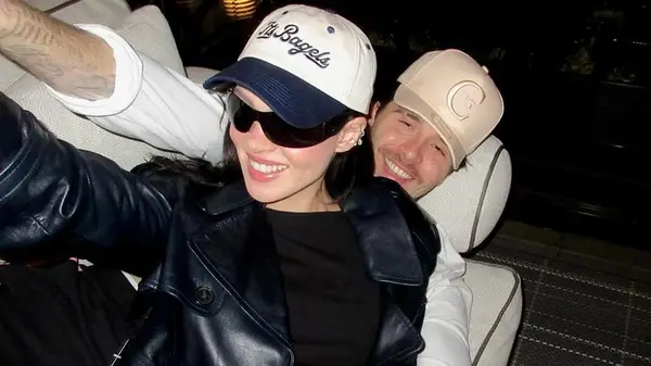 Nicola Peltz Beckham sitting on Brooklyn Peltz Beckham