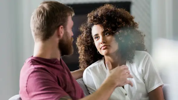 couple talking on couch