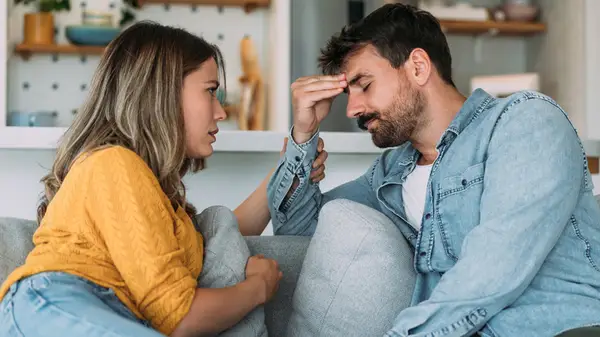 couple talking on couch