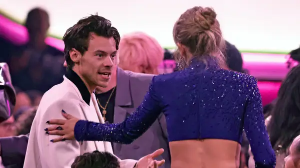 Harry Styles talking to Taylor Swift