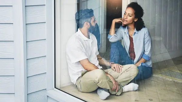 couple talking in window