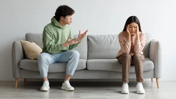 couple talking on couch