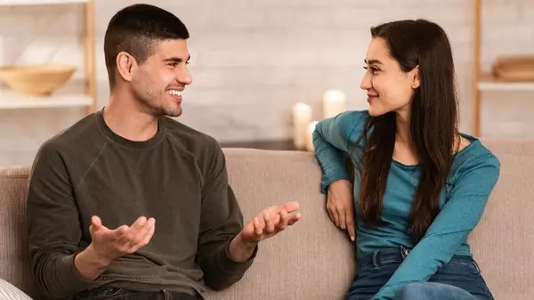 Couple talking on the couch