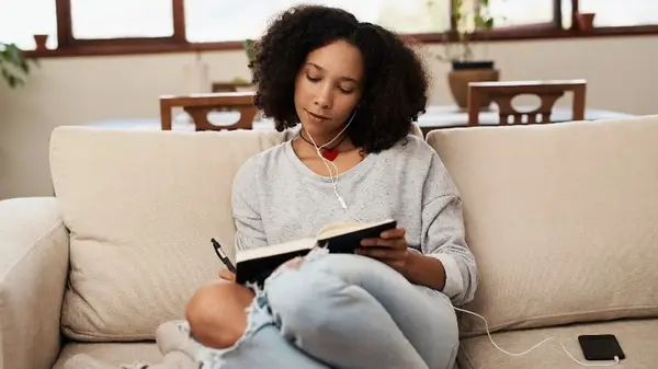 Woman writing in notebook