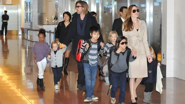 Brad Pitt and Angelina Jolie and kids at an event