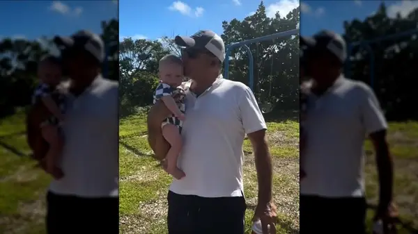 Nicholas Riccio with his son