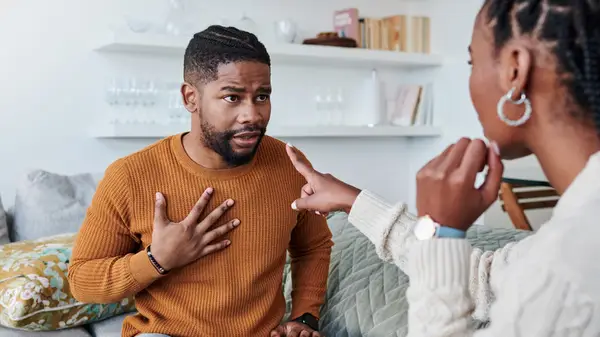 couple arguing on couch