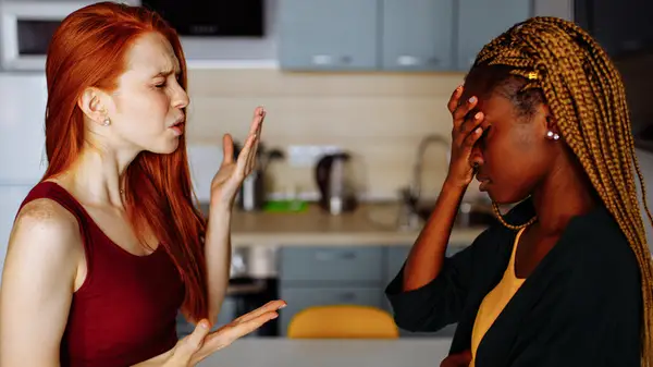 couple arguing in kitchen