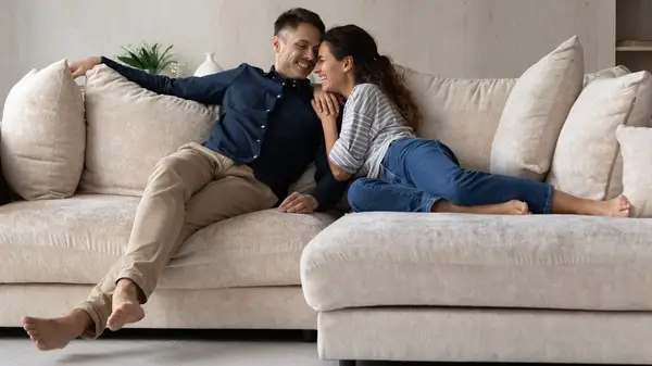 happy couple on couch