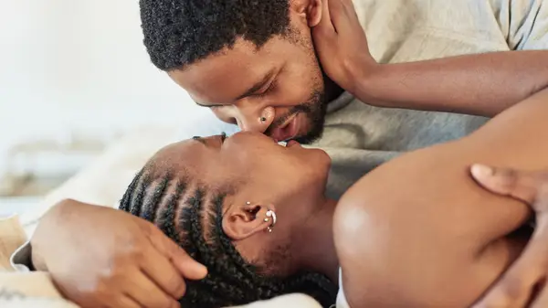 couple in romantic embrace in bedroom
