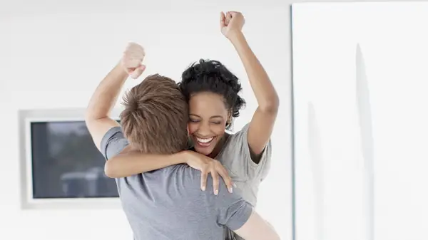 man and woman celebrating