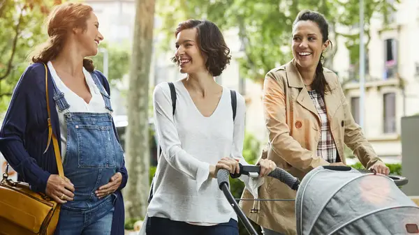 friends walking with stroller