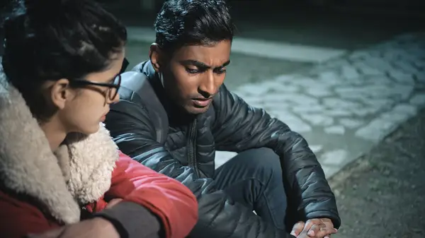 Couple conversing seriously