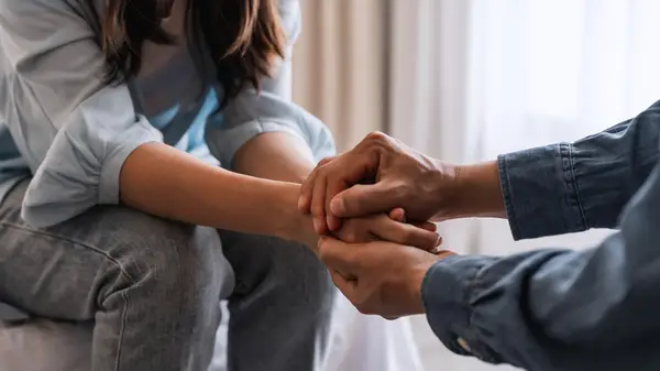 Couple holding hands