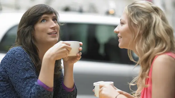 Two women talking outside