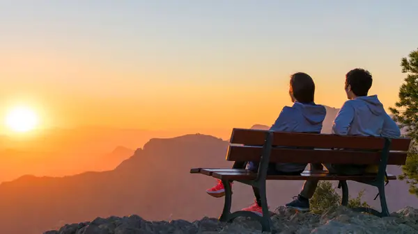 Couple watching sunrise