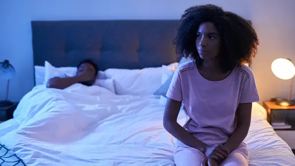 Looking anxious in bed