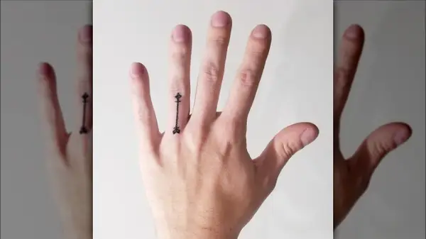 Arrow finger tattoo